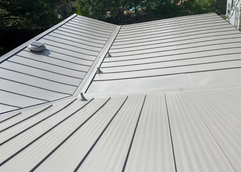 Solar attic fan installed on a metal roof for Roof Ventilation in Thomasville